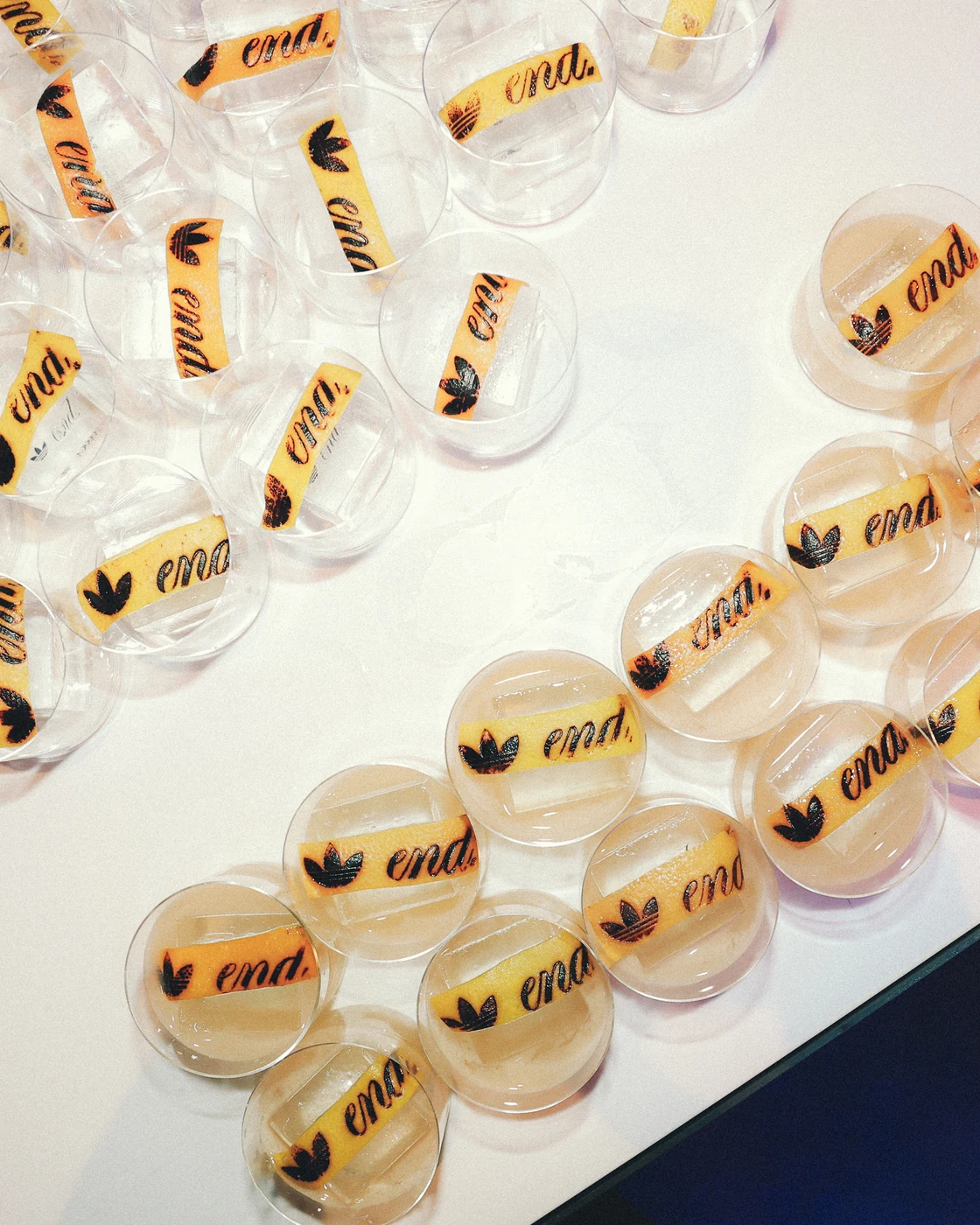 Cocktails with END. and adidas branded citrus garnishes